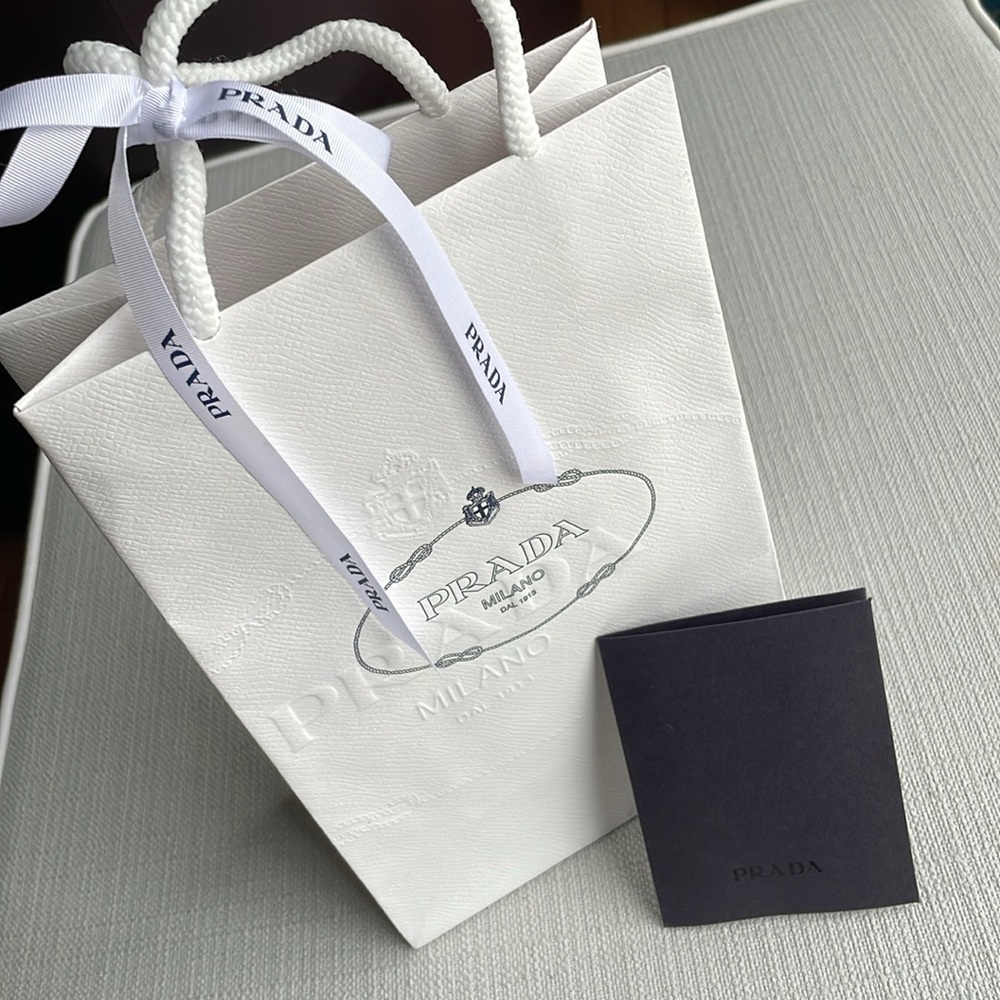 Prada empty white paper bag with ribbon and card